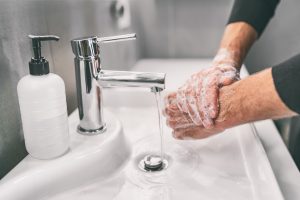 Man Washing Hands | Greenville Health Care